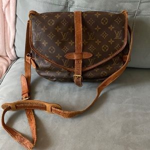 LV Bag. canvas is still in good shape. Needs someone to give it a new life.